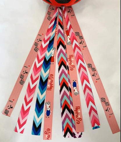 Children's helmet streamer with 60 cm polyester ribbon in colours like apricot and khaki for roller skating and skiing