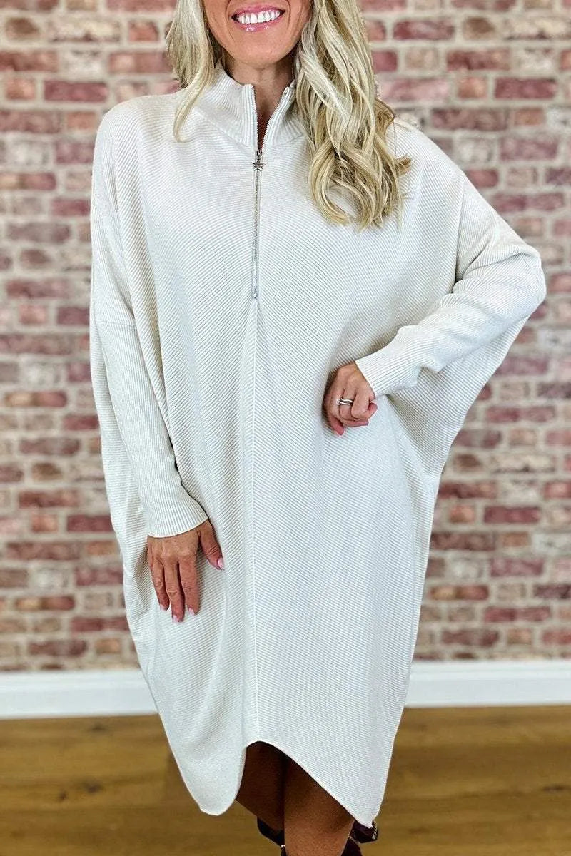 Women's solid colour loose fit knitted dress with raglan sleeves and a front zipper.
