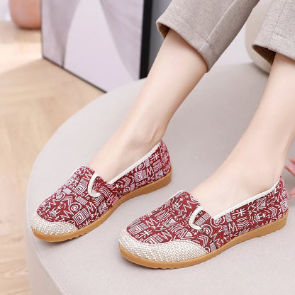 Women's ethnic style cloth shoes with shallow mouth design, colour stitching, and flat heel