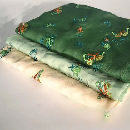 Pure ramie embroidery cloth hanfu fabric in beige, grass green, and dark green colours showing natural texture