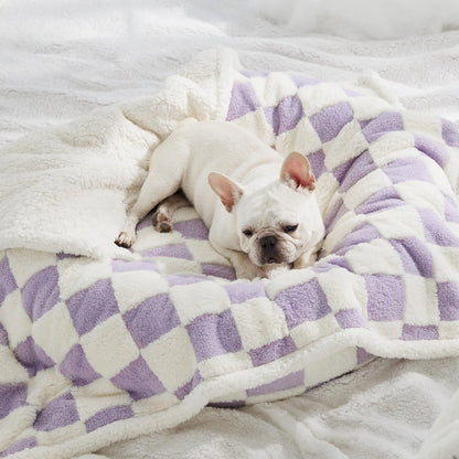 Blue and white patterned waterproof dog blanket on furniture showing cloth texture