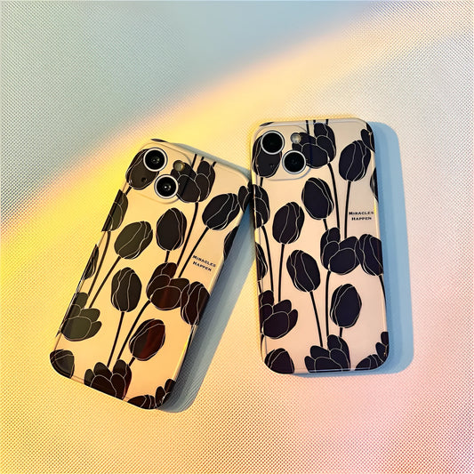 Cold Wind black silicone iPhone case with a white tulip floral pattern on the back.