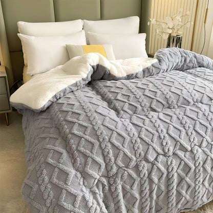 Double quilted plush quilt in sapphire blue showing detailed stitching and German velvet texture