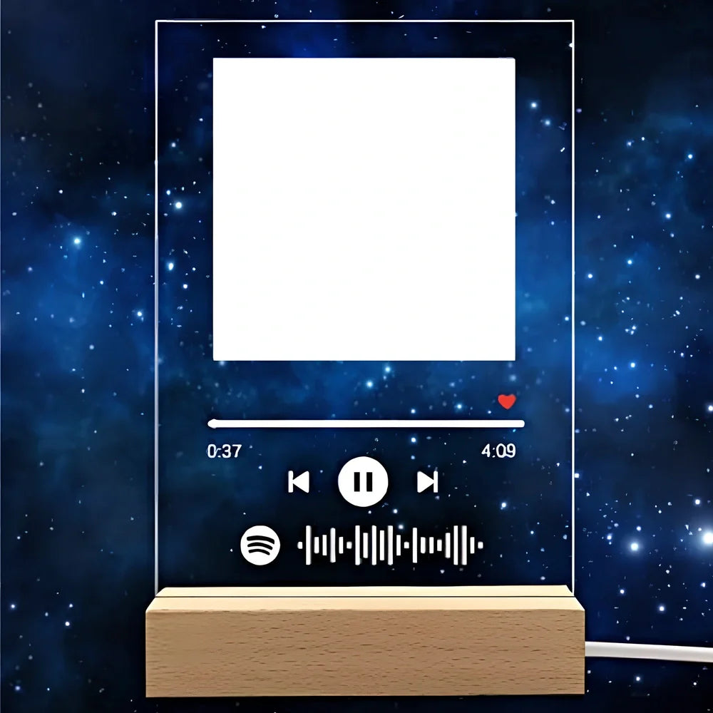 Customisable photo night light with 22x15cm acrylic panel showing engraved song lyrics beside personal photograph