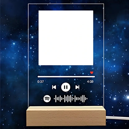 Customisable photo night light with 22x15cm acrylic panel showing engraved song lyrics beside personal photograph