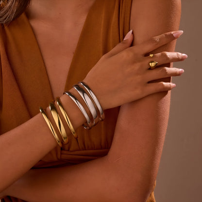 Women's stainless steel bracelet with geometric line design and simple opening clasp in gold electroplated finish