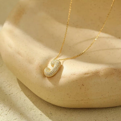 Stainless steel initial pendant necklace with zircon accents, personalized with your choice of letter.