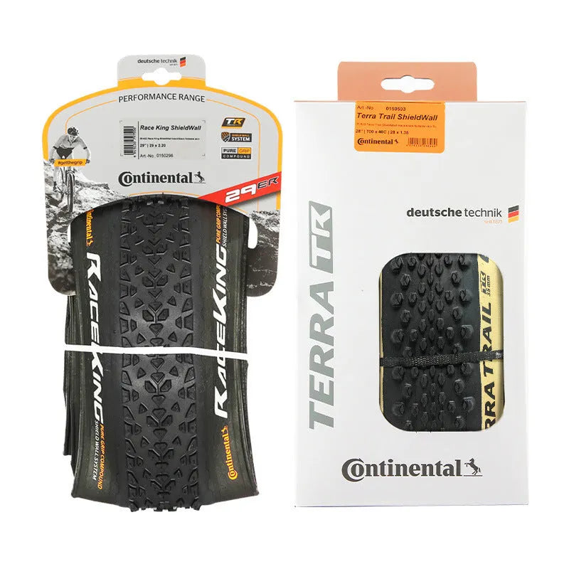 Mountain bike folding outer tyre with yellow sidewall, showing tread pattern and size label