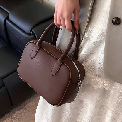 Retro square PU leather messenger bag with an adjustable shoulder strap in black colour.