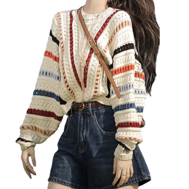 Rainbow striped batwing sleeve hollow knit sweater with round neck, shown in loose fit on model