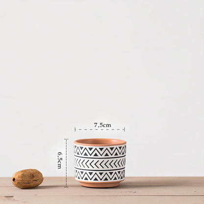 White ceramic geometric flower pot with Nordic design in three sizes for indoor plants