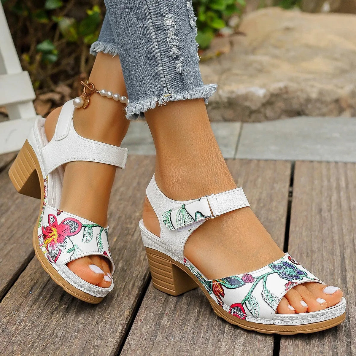 White women's high heel sandals with velcro buckle closure showing PU upper and rubber sole