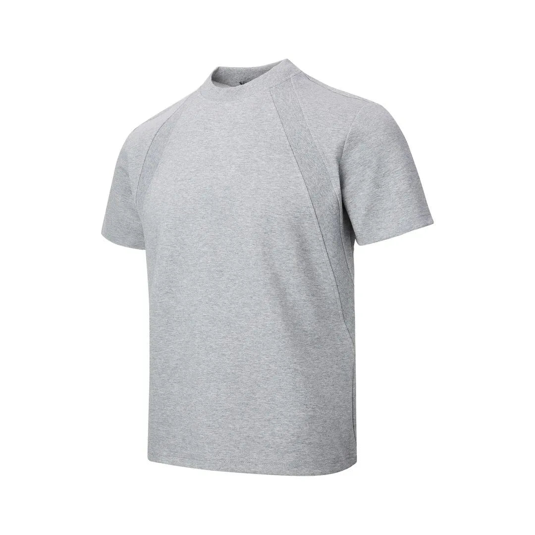 Man's loose fit black short sleeve top with textured air layer stitching detail.