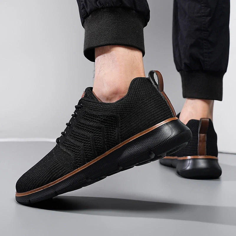 Men's black lace-up mesh sneakers with woven detail for casual and sports wear
