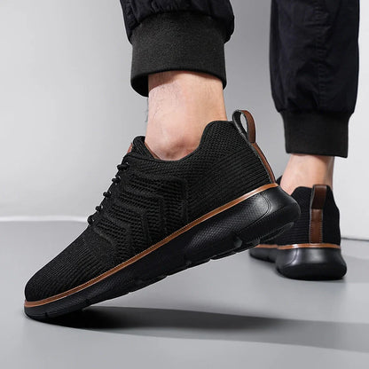 Men's black lace-up mesh sneakers with woven detail for casual and sports wear