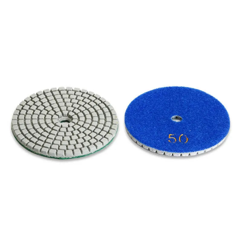 Set of 10 circular stone polishing pads with emery abrasive on a white background.