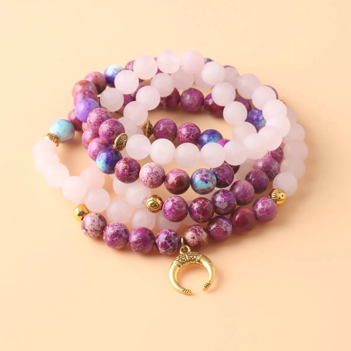 Round pink crystal emperor stone bead pendant on a women's personalised necklace.
