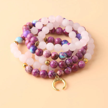 Round pink crystal emperor stone bead pendant on a women's personalised necklace.