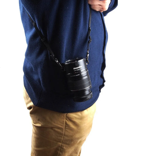 Aluminium alloy Nikon E-Mount lens flipper holding two camera lenses with cotton shoulder strap