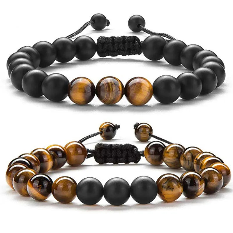Tiger Eye and black agate geometric couple bracelets laid out as a matching set.