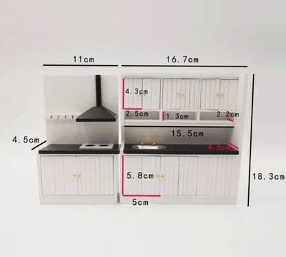 White two-piece dollhouse kitchen cabinet set with sink and stove units on a table.