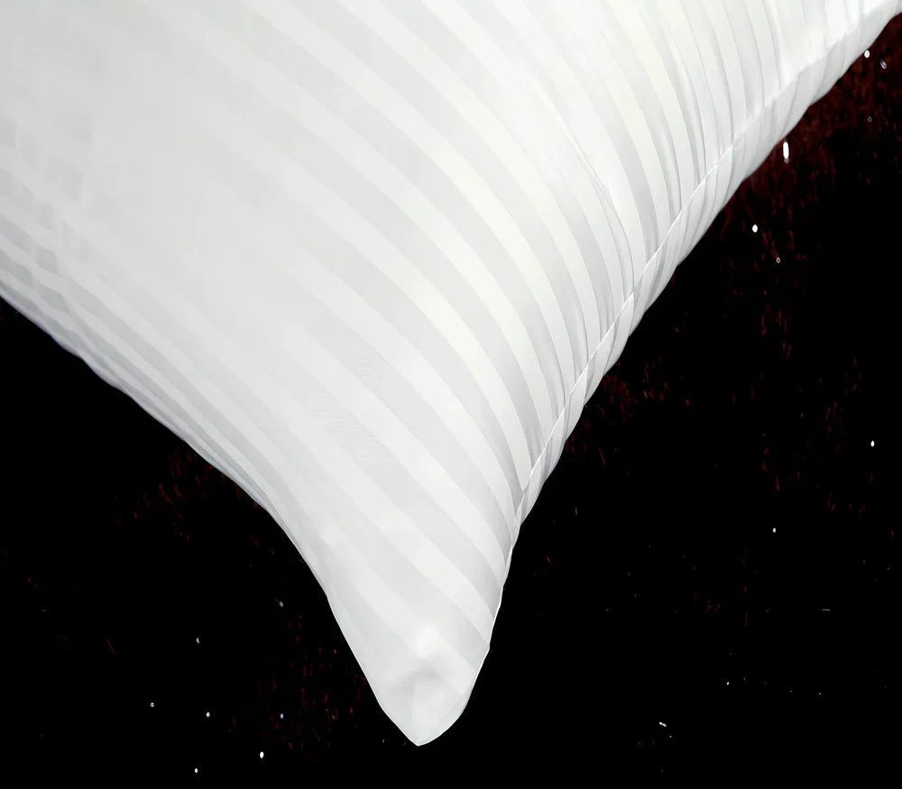 White square healthcare pillow measuring 40x70cm with polyester fibre filling