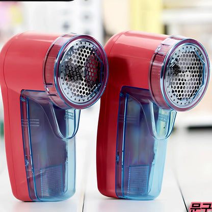 Portable electric lint remover device measuring 11x16x9.5cm with USB charging cable