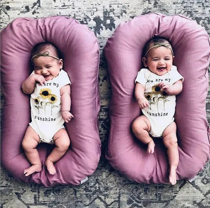 Beige portable cotton baby nest crib measuring 75 by 45 centimetres for newborn infants