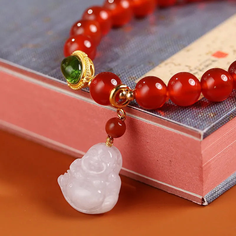 Handcrafted red agate bracelet with amber beads, jade accents, and Maitreya Buddha pendant in Chinese geometric style