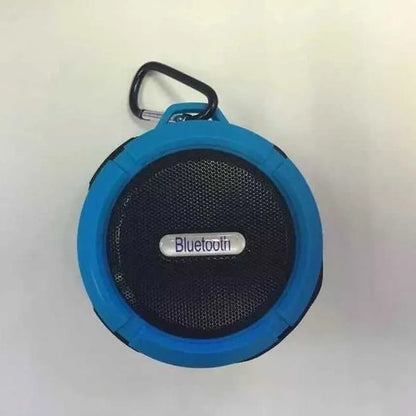 C6 portable waterproof Bluetooth speaker in multiple colours with a mounting clip attached.