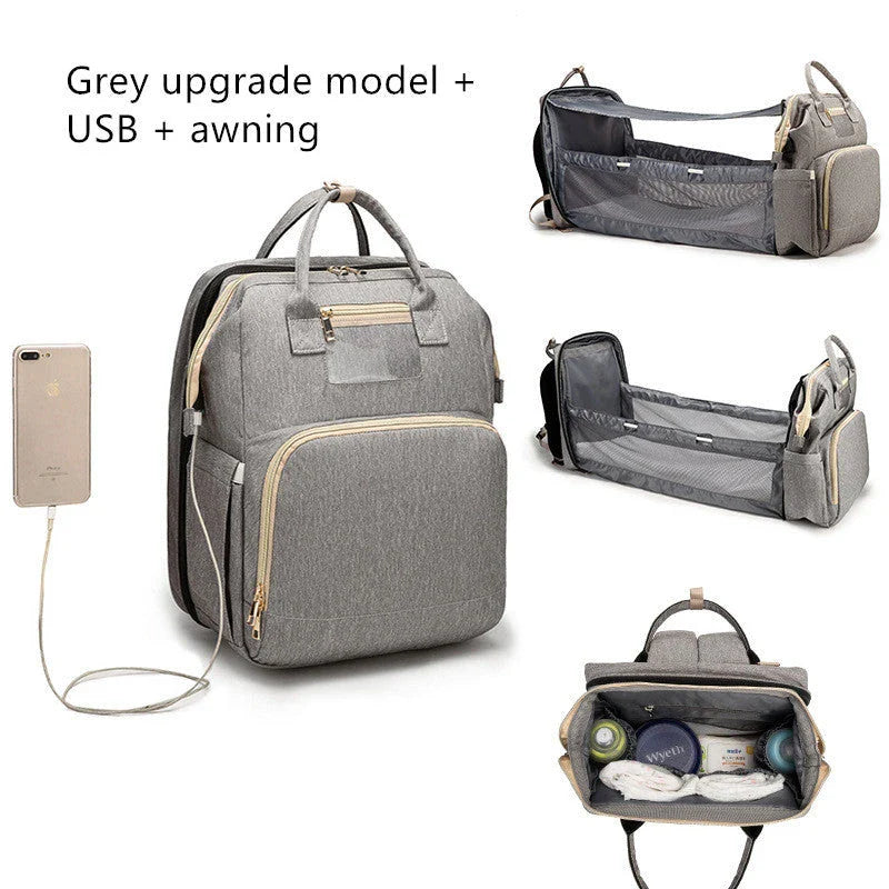Versatile baby changing backpack with USB charging port and folding portable bed