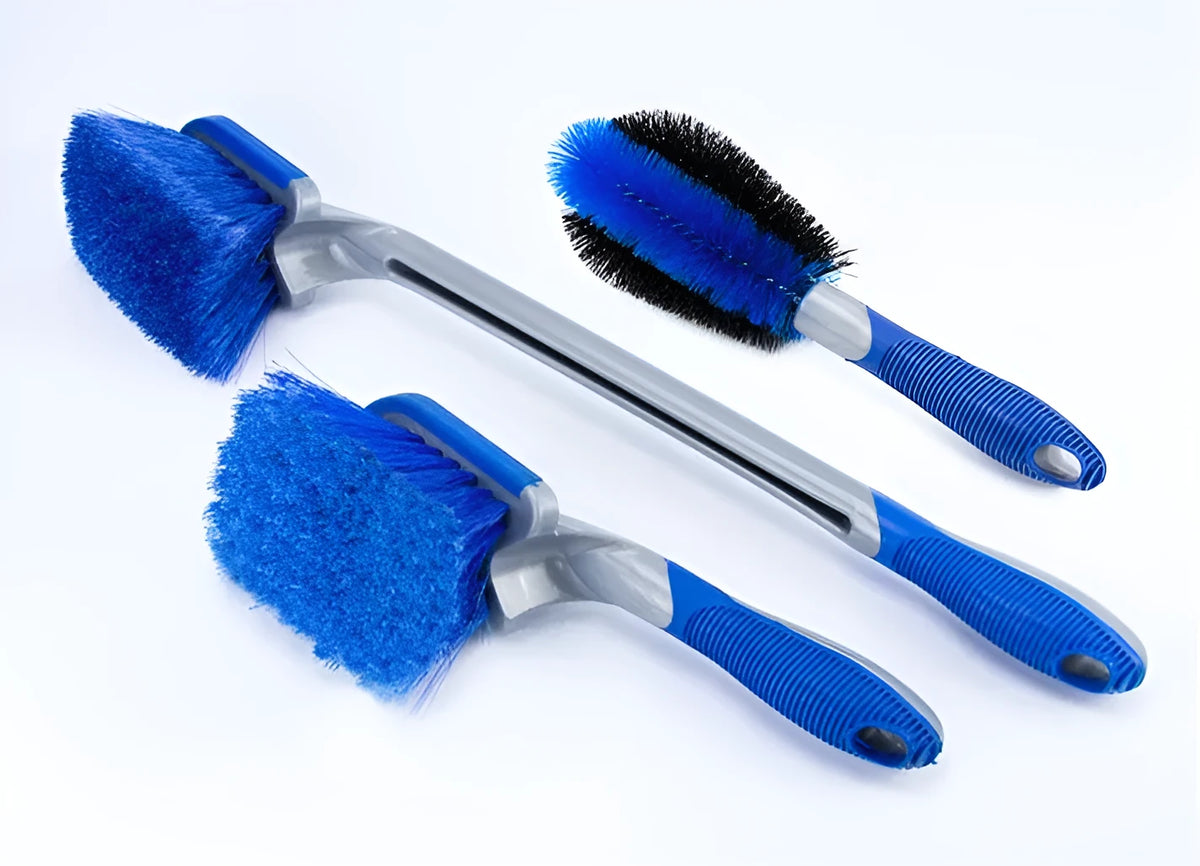 Car tire wheel brush with long handle and twisted yarn bristles for wheel hub cleaning.