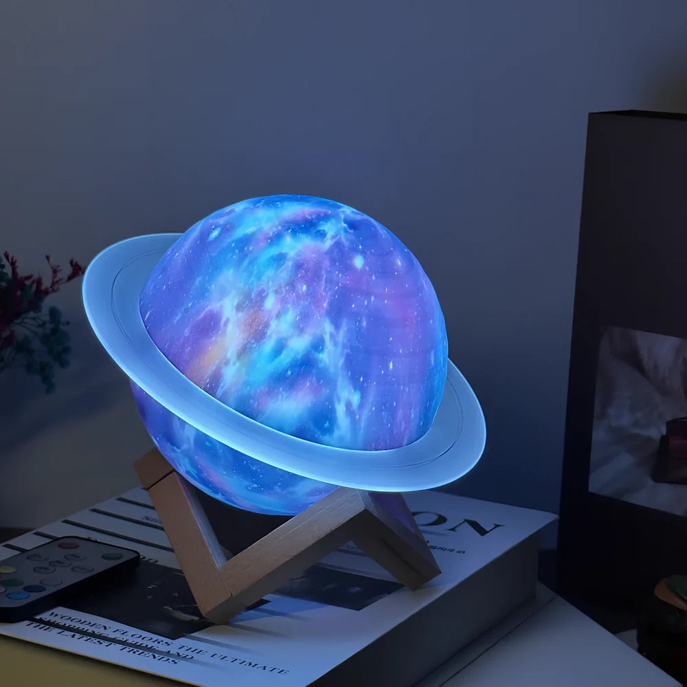 Rings of Saturn Dream Bluetooth Speaker showing 16.5cm dimensions with remote control and bracket accessories