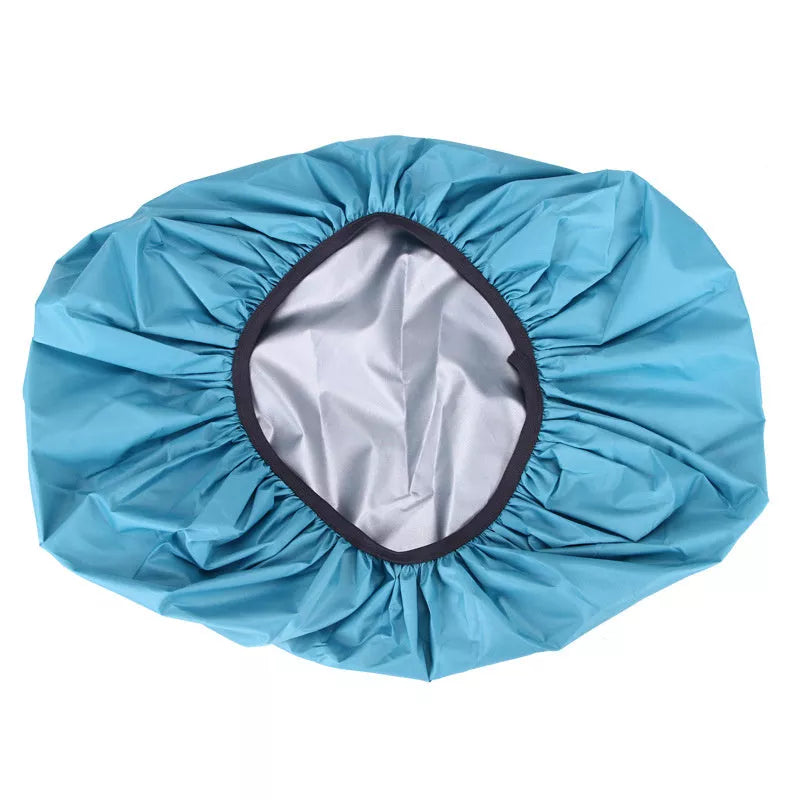 Waterproof backpack cover in various colors, showing elastic edge and compact fold