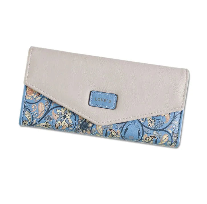 Three-fold leather wallet with buckle closure showing black colour variant, note clip visible inside compartment