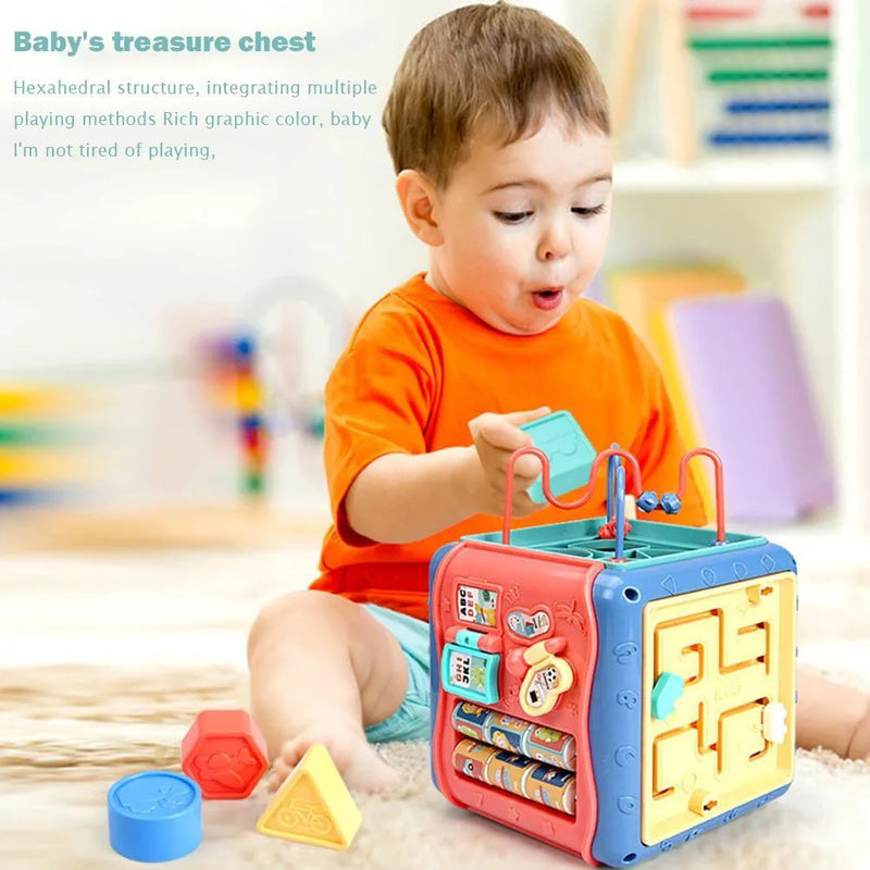 Baby educational toy hexahedron box with six-sided Montessori shape games including bead maze, gear connection, car maze, clock, butterfly, and number tray for early maths learning and sensory development in colourful ABS plastic 17 cm cube