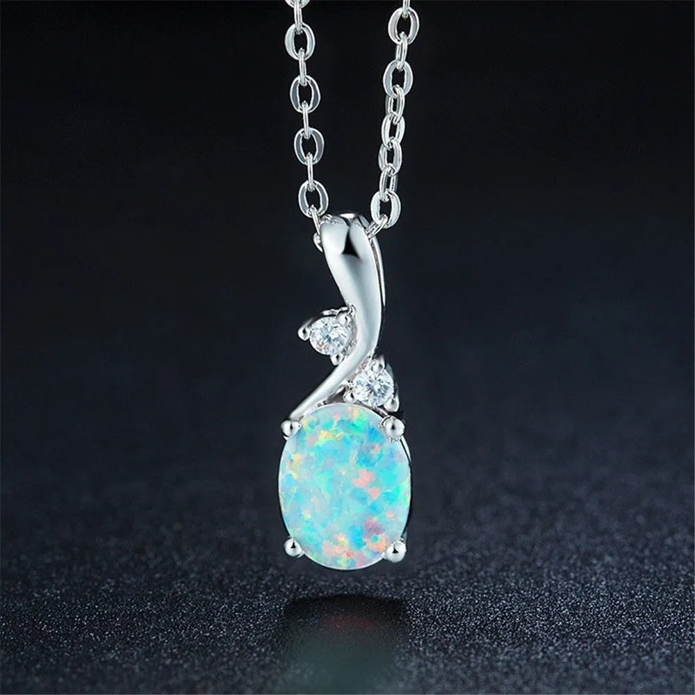 Water drop shaped opal pendant on an adjustable O-chain necklace in rose gold finish.
