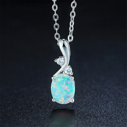 Water drop shaped opal pendant on an adjustable O-chain necklace in rose gold finish.