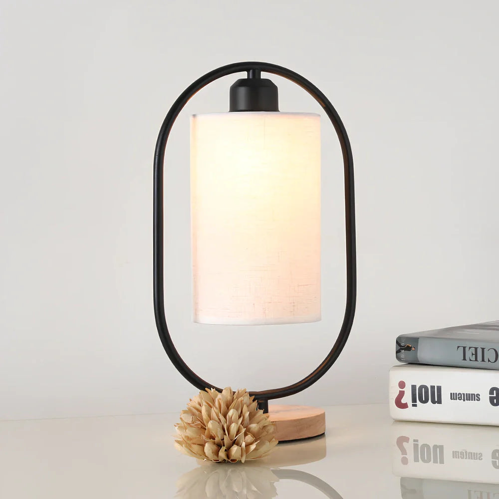 Black metal bedside lamp with dimming button and 5W LED warm light on wooden table