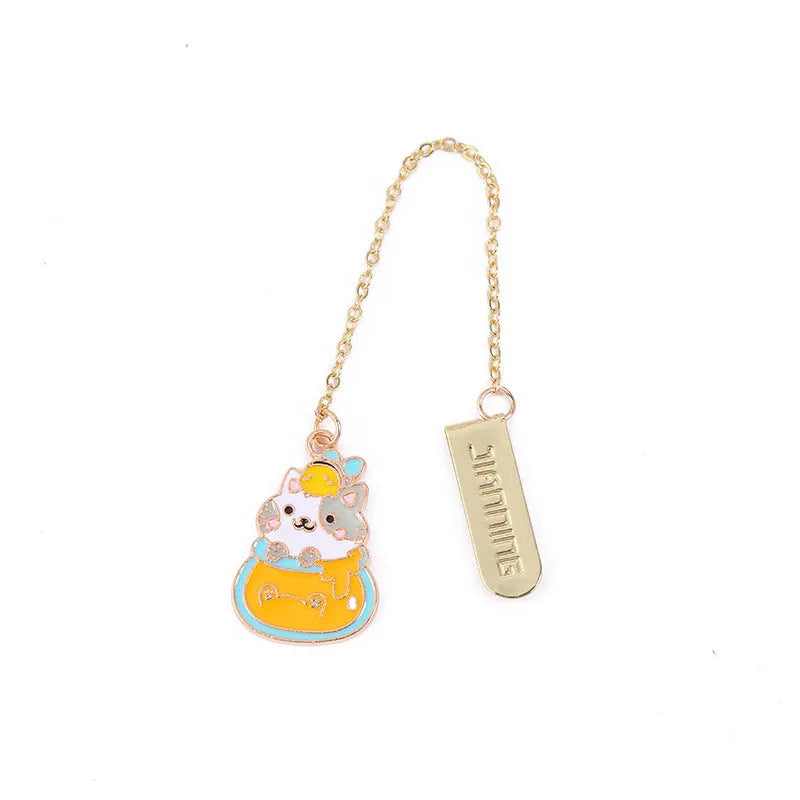 Jane Lime Foodie cat creative metal bookmark with cartoon pendant on a book page.