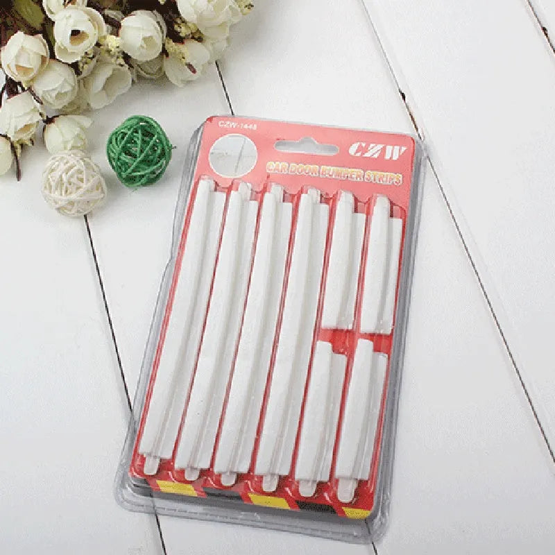 White plastic car door edge protection strip measuring 1.5cm wide and 3mm thick