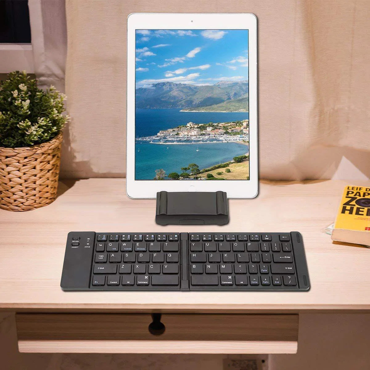 Ultra-portable wireless Bluetooth keyboard with foldable design for smartphones and tablets