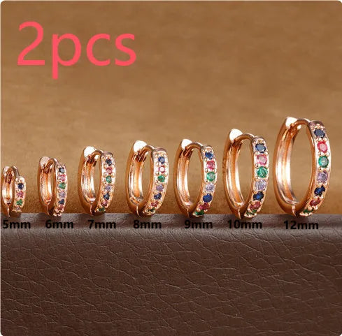 Circle zircon perforated stud earrings in gold, rose gold, silver colours with geometric design and multiple size options