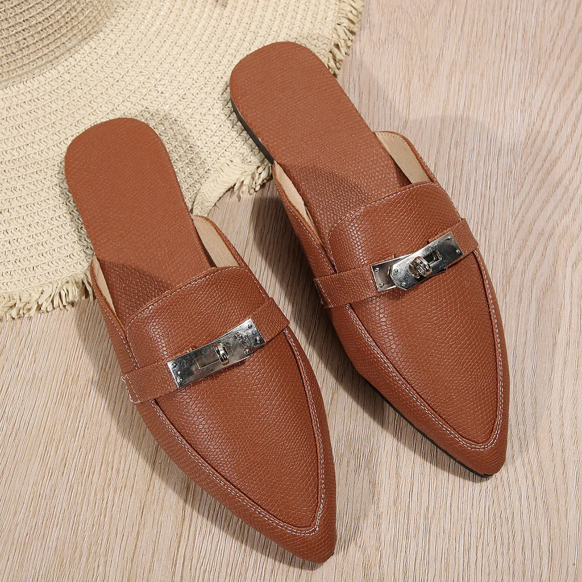 Light brown women's pointed-toe low heel slip-on slippers with a PU leather upper and rubber sole.