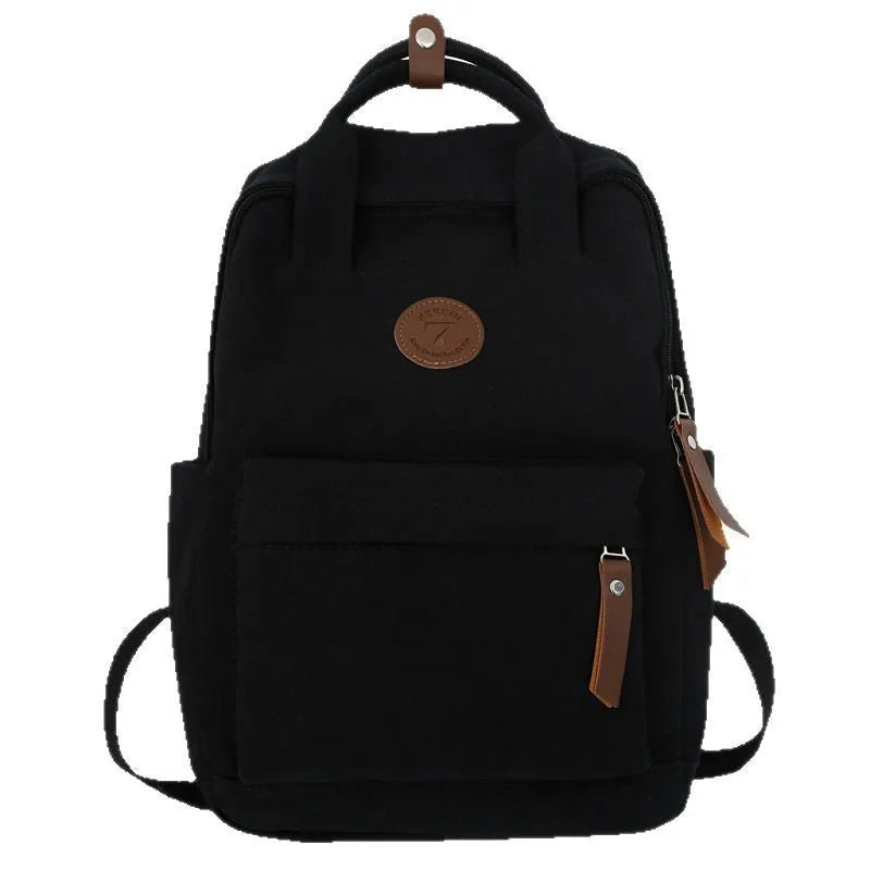 Black Oxford cloth fashion backpack with curved shoulder straps and retro sewing details