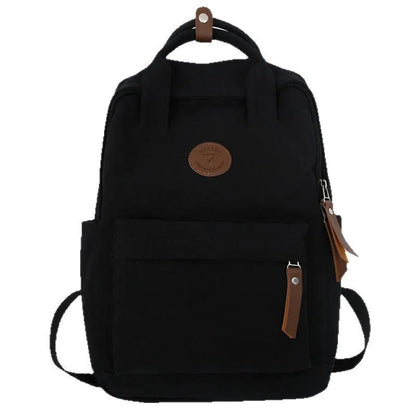 Black Oxford cloth fashion backpack with curved shoulder straps and retro sewing details