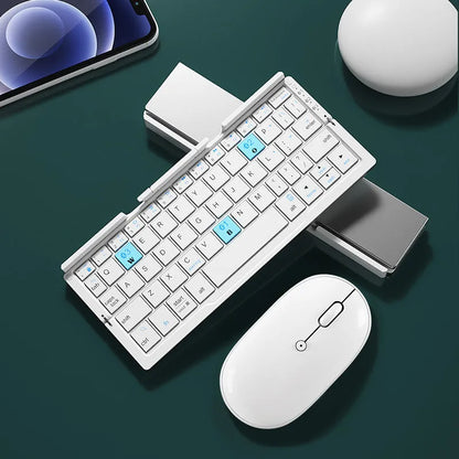 Silver white folding Bluetooth keyboard with stand holding tablet, showing compact folded size