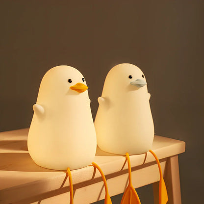 Seagull-shaped silicone night light in blue or yellow measuring 96.5×91×130mm with tap controls