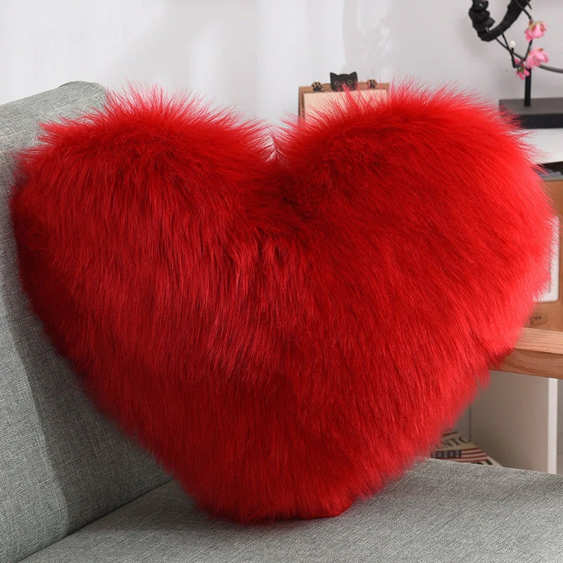 Cozy heart-shaped plush throw pillows in various colors and sizes for living room and bedroom decor