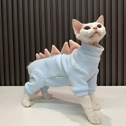 Dinosaur costume on hairless Sphynx cat showing fleece material and decorative spikes